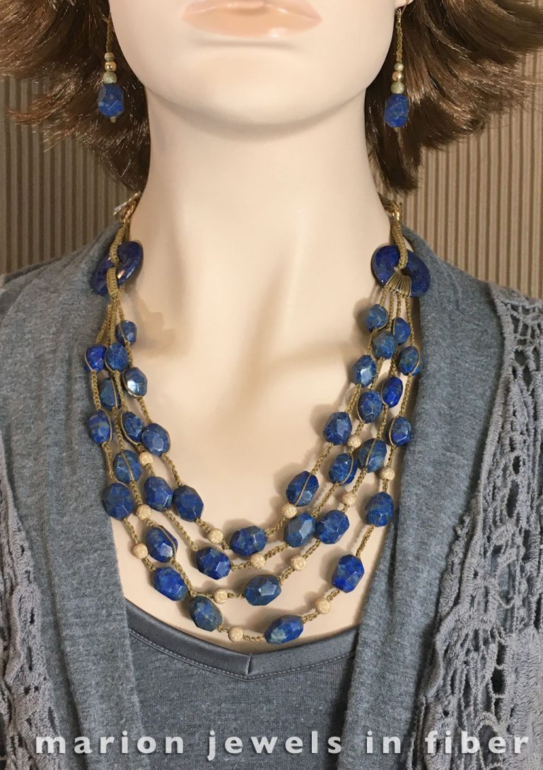 Quadruple Lapis and Gold Crochet Neckpiece - Crocheted and knotted nylon cord, cord making, lapis faceted beads, lapis donut beads, gold plated toggles and beads, adjustable from 25” to 36” long - $395. Earrings with gold plated leverbacks - $39. Quadruple Lapis and Gold Crochet Neckpiece - Crocheted and knotted nylon cord, cord making, lapis faceted beads, lapis donut beads, gold plated toggles and beads, adjustable from 25” to 36” long - $395. Earrings with gold plated leverbacks - $39.