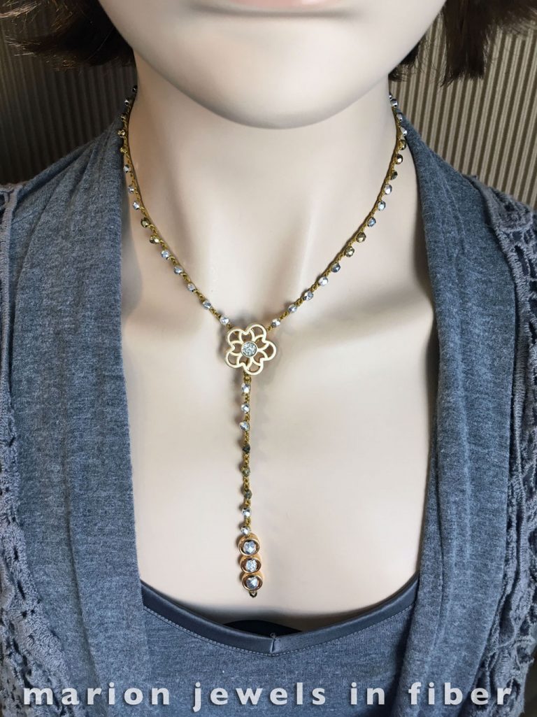 Y Crochet Necklace - Crocheted nylon cord, Czech fire polished beads, unique Italian metal buttons, Halo beads, 17.5” long with 4.5” drop, button clasp closure in back - $69. Available or made to order in many other colors and length. Y Crochet Necklace - Crocheted nylon cord, Czech fire polished beads, unique Italian metal buttons, Halo beads, 17.5” long with 4.5” drop, button clasp closure in back - $69. Available or made to order in many other colors and length.