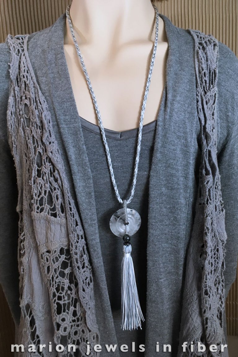Black Tourmaline Quartz Double Donuts with Tassel - Knotted and braided nylon cord, handmade tassel, black tourmaline and hematite beads, sterling silver clasp, 32” cord with 6.5” drop - $112. Black Tourmaline Quartz Double Donuts with Tassel - Knotted and braided nylon cord, handmade tassel, black tourmaline and hematite beads, sterling silver clasp, 32” cord with 6.5” drop - $112.