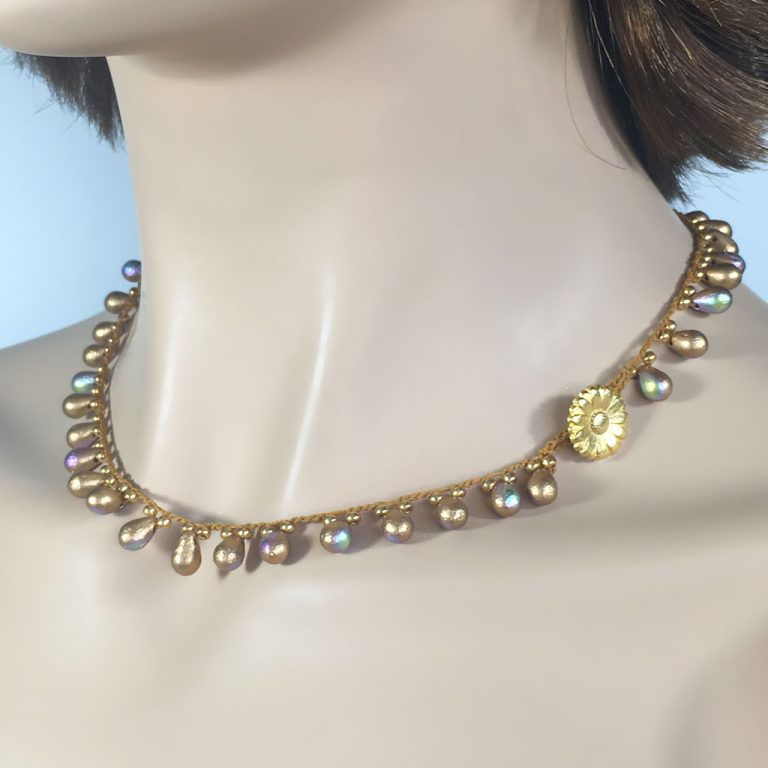 Aztec Gold Drop Bead Crochet Necklace, $49. Aztec Gold Drop Bead Crochet Necklace, $49.
